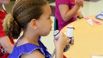 A student enjoys chocolate milk as a part of her school`s breakfast offering. While breakfast programs are not a new concept, research shows more students will eat school breakfast if served outside the cafeteria. Watkins Elementary School in Columbus, Ohio adopted breakfast-in-the-classroom and teachers have seen significant improvements from their students. The Ohio School Breakfast Challenge hopes to see more success stories like this. Click here for more: bit.ly/1Ex981U